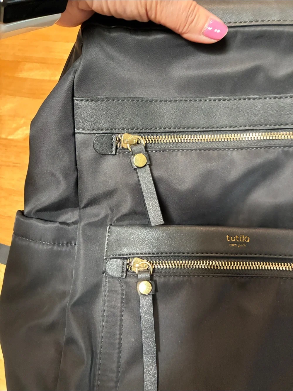 Tutilo Black Men's Backpack with Gold Zipper Accents